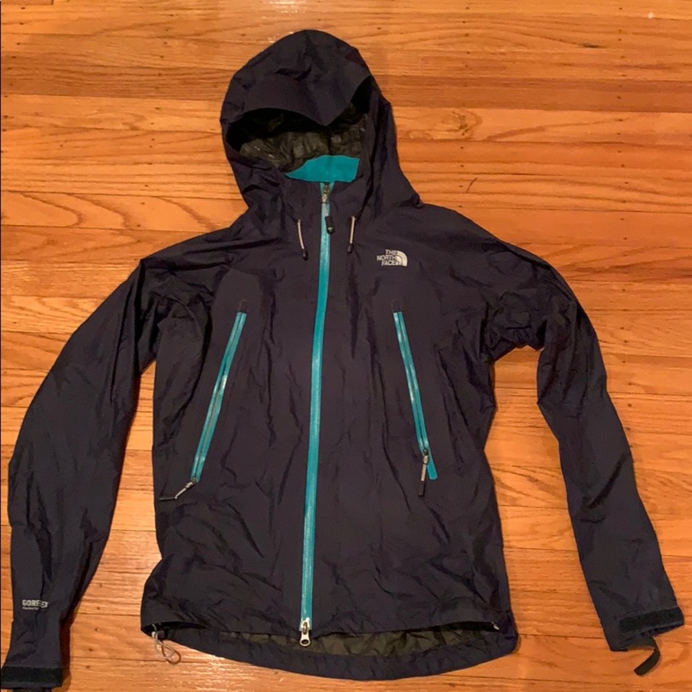 North Face navy raincoat with turquoise details